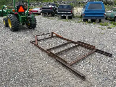 Two landscaping drags. Used with my 30 hp Tractor. First one has two grader cutting edges and a plac...