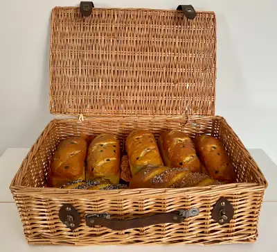 Large basket with feau bread loaves. In very good condition. Great for restaurant or table display....