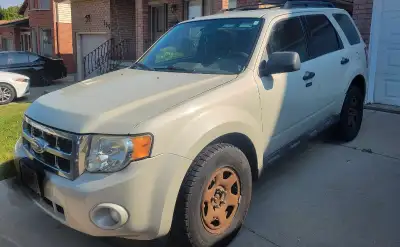 Selling "as is " ford escape . Engine runs and a.c blows cold. 4 cylinder engine. Snow tires are on...