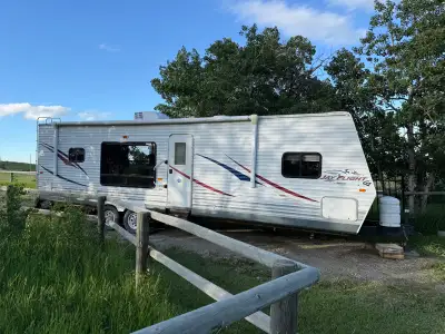 Slide, power awning, A/C, furnace, extra large fridge freezer, stove, microwave, shower, toilet. Not...