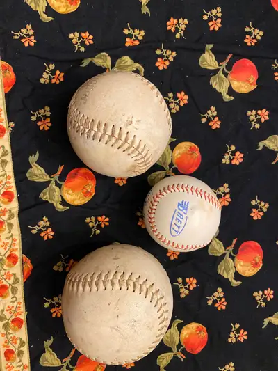 Softballs and one tee ball, View more