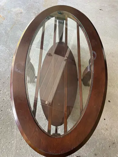Leon's Solid Wood Oval Coffee Table with Glass Top — $60, View more