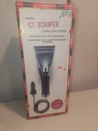 Keep your windshield clear in the winter with this No. 18 heated ice scraper featuring a built-in fl...