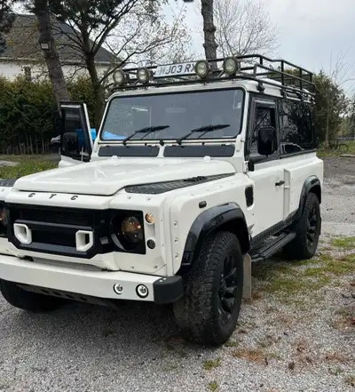 Presenting a 2003 Land Rover Defender 90, a robust and rugged right-hand-drive station wagon that em...