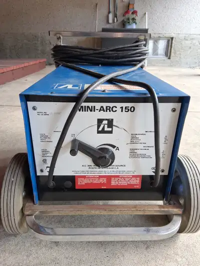 Miller 150 Mini-Arc welder. 18 ft. ground cable. 22 ft. stinger cable. Mounted on cart. Burnes 1/8 r...