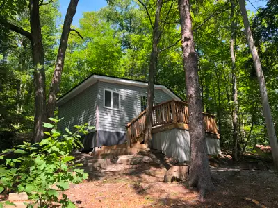 The Shady Nook studio plus cottage has one bedroom plus a pullout sofa bed, sleeps four people, thre...