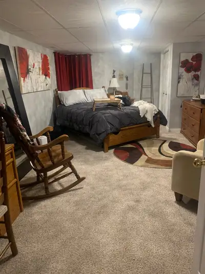 Furnished one bedroom and living room with kitchenette, 1.5 bathrooms. Located in basement of home....