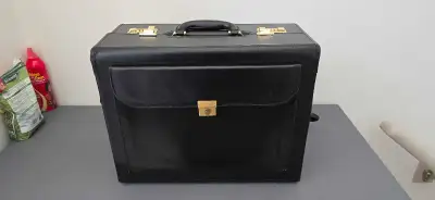 This brand new briefcase is a stylish and functional accessory, perfect for professionals on the go....