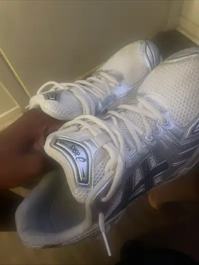 Selling a pair of ASICS Gel-Kayano 14 in silver, US size 11. The shoes are used but still in good co...