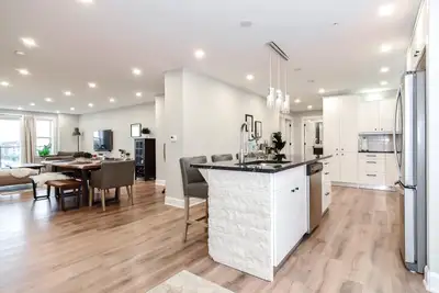 Luxury Apartment in Bedford. Open-concept layout, elegant kitchen with fine intricate molding detail...