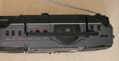 This Vintage Sanyo MCD45K Boombox with AM/FM SW1,SW2,CD & Cassette Player is rare found sale in the...