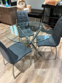 Glass table for sale , small sized with 3 chairs