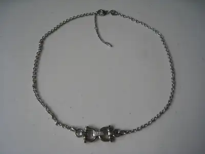 Silver tone with clear crystals necklace from Fossil. Short adjustable chain. Like new condition, no...