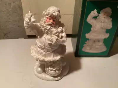 Downsizing and moving . Comes in the original box. Beautiful white Santa ornament. No chips or crack...