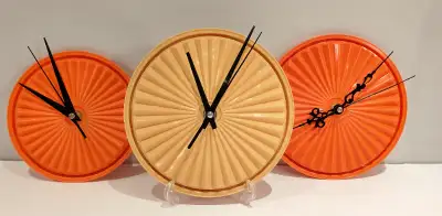 Tupperware wall clocks, View more