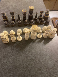Vintage hand crafted wooden chess pieces.