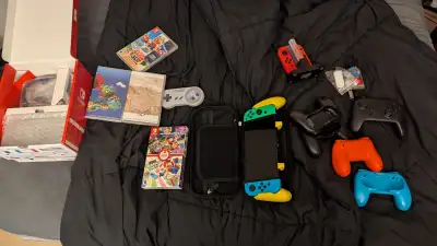 OLED Nintendo switch with many extras., View more