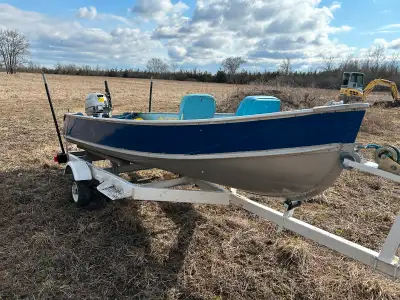 12ft aluminum fishing boat with trailer. 2008 9.9hp Honda four stroke motor with electric start and...