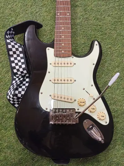 Jay Turser Vintage Series Stratocaster Style Electric Guitar with Tremolo Arm (Whammy Bar). Well car...