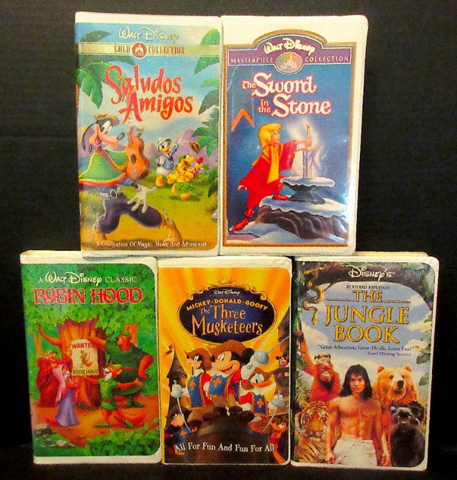 Disney Clamshell Movies VHS x 5 "Robin Hood,SwordinStone,etc" VG in CDs, DVDs & Blu-ray in Stratford