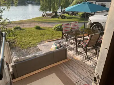 Beautiful 34’ trailer on the water. Kayak, paddle boat, 40’ dock, great fishing, golf nearby, much m...