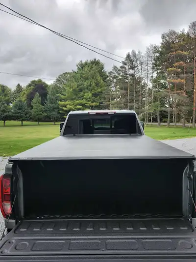Brand new tonneau paid over $900. Have gone a different direction with the truck no need for this co...