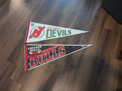 I'm offering a set of used sports pennants featuring the New Jersey Devils (NHL) and Chicago Bulls (...