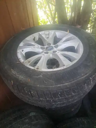 Selling a set of four Ford tires and rims, size P255/65R18. These used tires are still in usable con...
