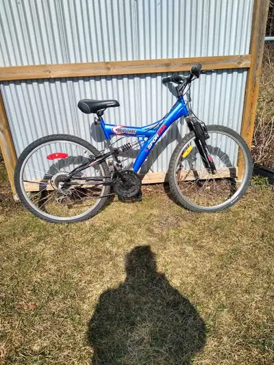 Mud Dog , Duel suspension. 26 inch wheels. 18 speed . New saddle. W/ helmet.