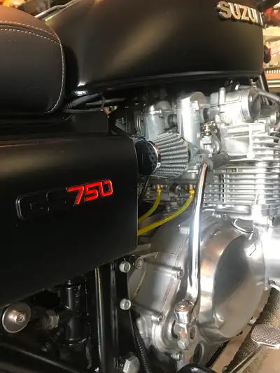 GS 750 with custom seat and exhaust. Rebuilt in 2016. Matte black paint, chrome fender and more.