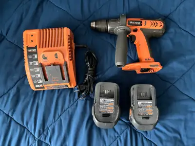 Ridgid Drill with 2 batteries and charger., View more