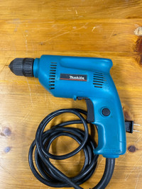 Makita 6410 keyless chuck drill.