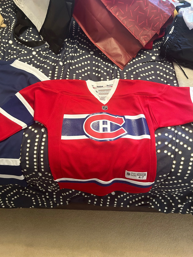 Boys leaf jersey size 10-12. Boys canadiens jersey size 4-7 in Kids & Youth in St. Catharines