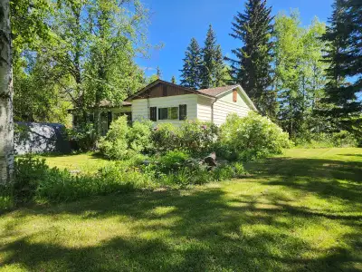 Expansive and lush 9.26 acre residential acreage property within a short 4 min drive of Smithers BC...