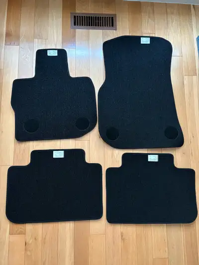 One set (4 pieces) brand new BMW X3 SUV automotive floor mats. Made in USA. Never used as we bought...