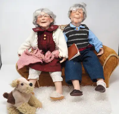 2 Seniors on Couch w/ Dog at their Feet Dolls, View more