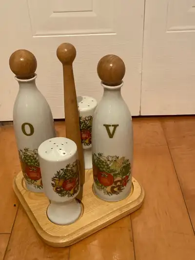 Elevate your dining experience with this charming vintage oil and vinegar set, complete with salt an...