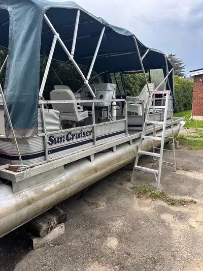 24’ pontoon with a 50hp Johnson motor. No trailer