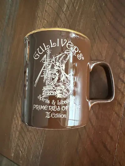 Pick up in Cranston. Brand New Gulliver‘s restaurant coffee mug. This was a Calgary vintage restaura...