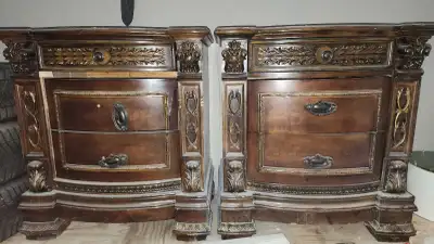 Description Set of 2 matching solid wood nightstands with a classic, ornate design. Details: Heavy,...