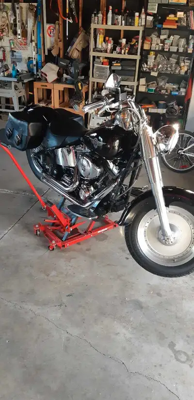 2000 Harley davidson fatboy 1450 Vance and hines short pipes. Harley davidson saddle bags cover Heme...