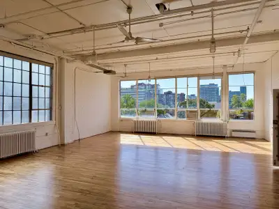 3rd floor Studio /Office with wood floors, 13 ft ceilings, 2pc washroom, large industrial windows fa...