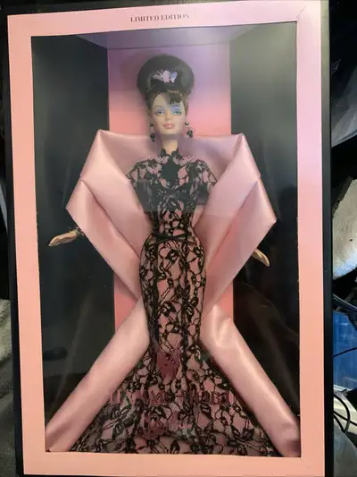 This limited edition Hanae Mori Barbie doll is a stunning collectible, featuring a black lace gown w...