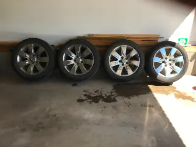 4 Buick Rims + Winter Tires - note one rim has a ding in it (from a pot hole) and won't hold air. Te...