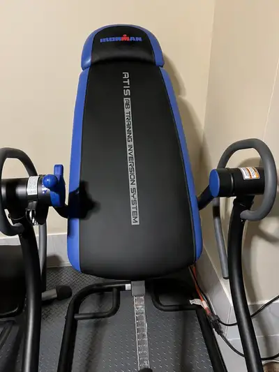 Iron Man ATIS inversion table and ab training table as new never used Model: 5000 Price is $250