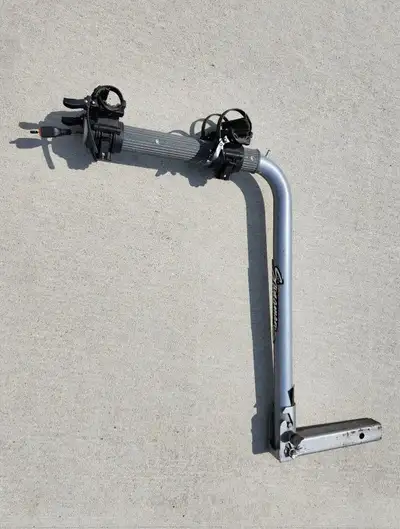 Selling a used bike rack which mounts into a 2” receiver on your vehicle, holding two bicycles. Used...