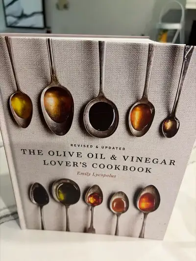 Explore the culinary world of olive oil and vinegar with "The Olive Oil & Vinegar Lover's Cookbook"...