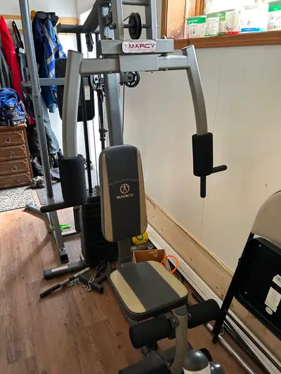 Universal gym-- not being used anymore. In good condition except for one broken cable that needs to...