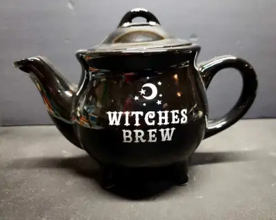 New Black ceramic Teapot with the words Witches Brew on it. New never used and comes in original box...