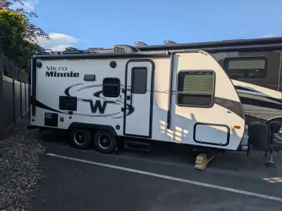 2017 Winnebago Micro Minnie 2106DS with 2 sofas and a fold-up queen mattress. Has 2 6V batteries and...